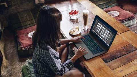 Woman working with photos on her laptop